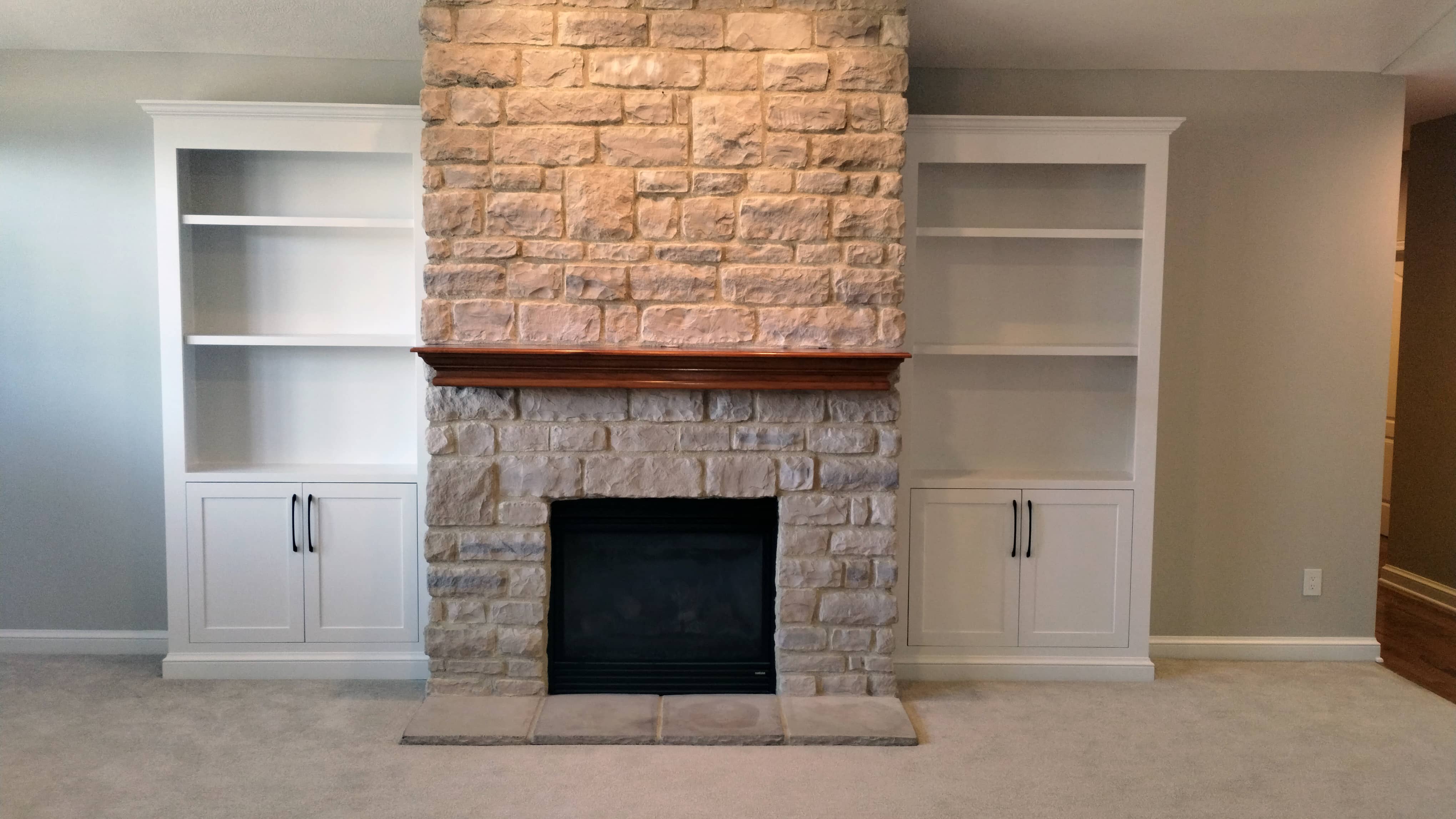 fireplace with builtin cabinets